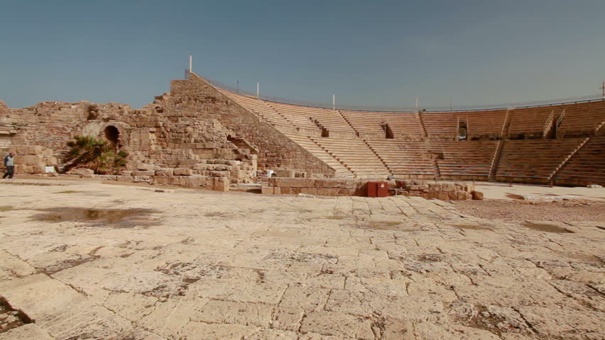 Very wide slider dolly move left to right of the theater at the ruins of