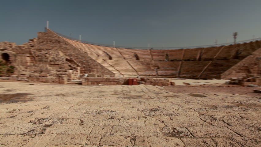 Very wide pan left to right of the theater at the ruins of Caersarea, Israel. 