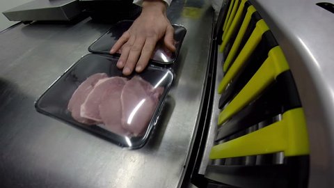 Freshly Packed Raw Pork Chops / Freshly raw pork chops packaging process in meat industry HD1080p