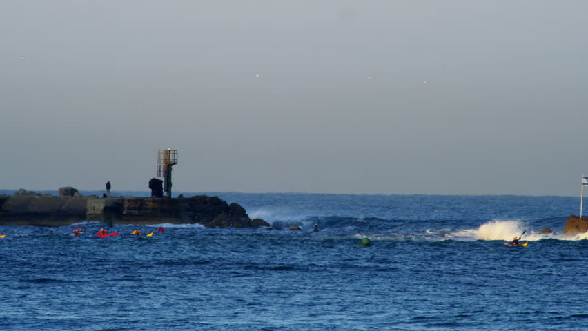 Tel Aviv, Israel Jaffa coast, Sunrise, crashing waves, Early morning  Kayakers