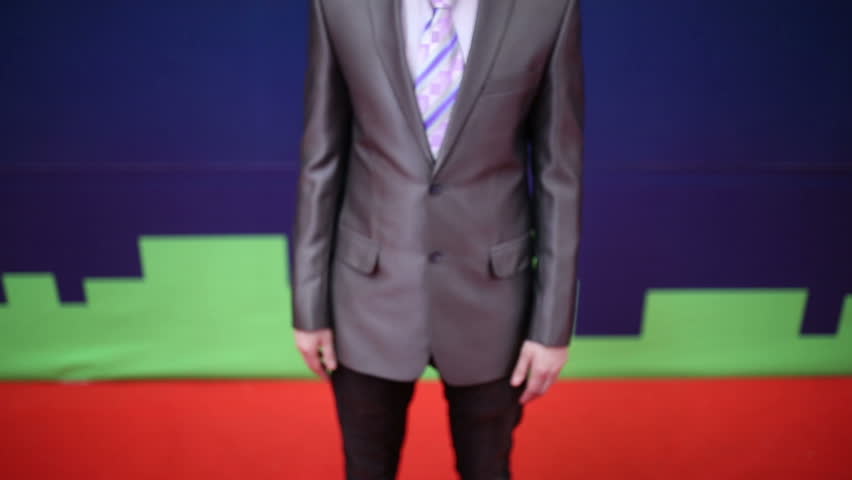 Businessman in a suit crosses his arms