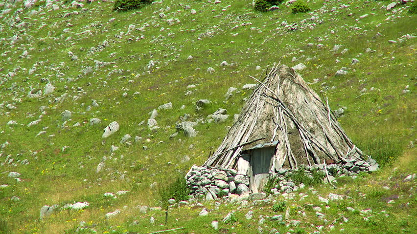 Traditional old cottage made of straw and sticks on the mountain