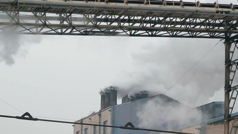 Factory chimneys emitting smoke to the air. HD 1080i. 