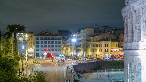 view of square near Colosseum illuminated at night timelapse in Rome, Italy