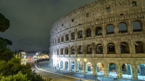 view of Colosseum illuminated at night timelapse hyperlapse in Rome, Italy