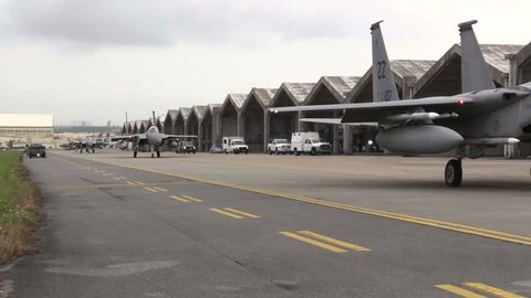 CIRCA 2016 - Numerous F-15 fighter jets line up and taxi for takeoff during a US Air Force Airshow. Filmed using a Sony EX-3 in full HD.