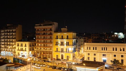 Timelapse video. Bari at night. Traffic near Stazione Centrale (Train Station)
