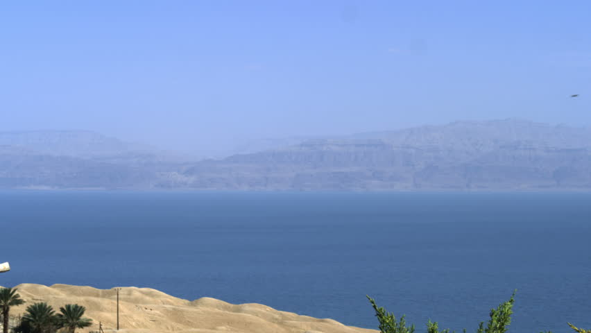 Pan left to right of a small portion of the Dead Sea in Israel and shoreline