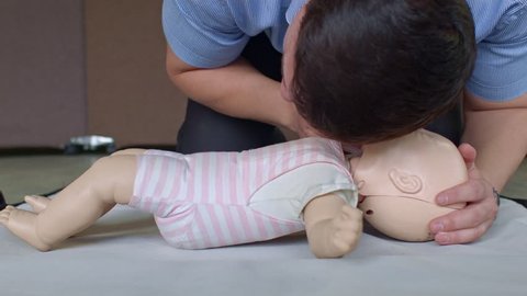 First aid cardiopulmonary resuscitation training on toddler manikin