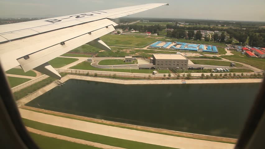 An airplane lands at Beijing International Airport