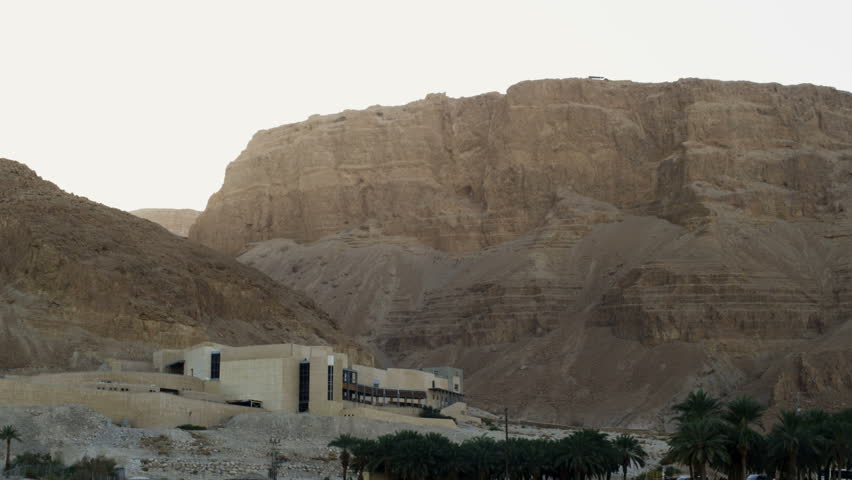 Pan left to right, on mount Masada, Israel.  the Masada school, and tourst