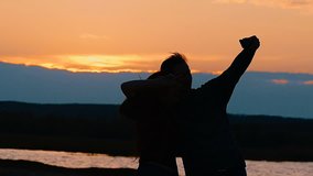 girl and guy photographed silhouette slow motion video