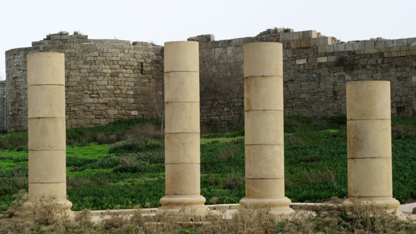 Columns at the Caesarean ruins in front of the wall of the amphitheater, off the