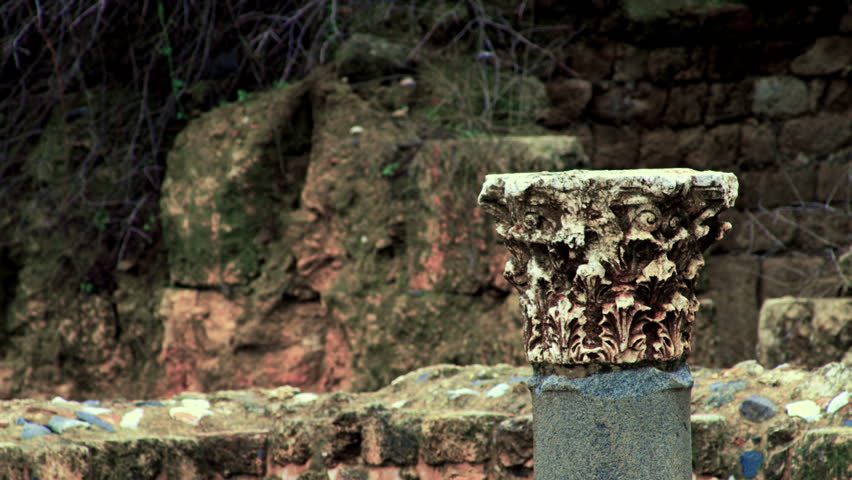 Still compressed shot of the top of a decorative pillar still standing at the