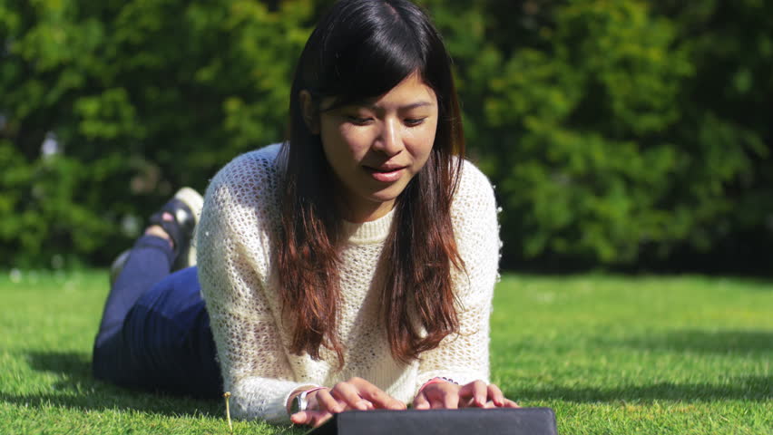 My friend's lovely day spent at the park reading and writing on a tablet, 4k