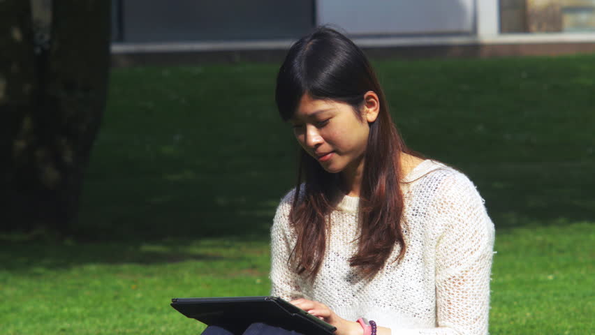 My friend's lovely day spent at the park reading and writing on a tablet, 4k