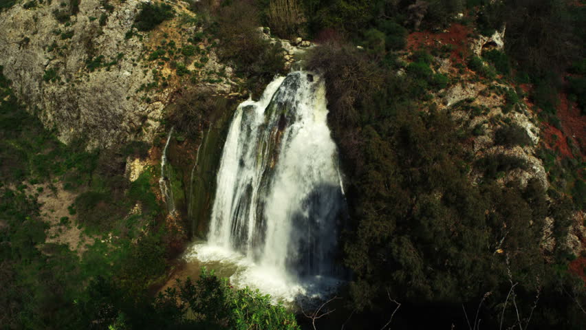 Wide shot, framed from a high angle, of the Tahana Waterfall near Metula,