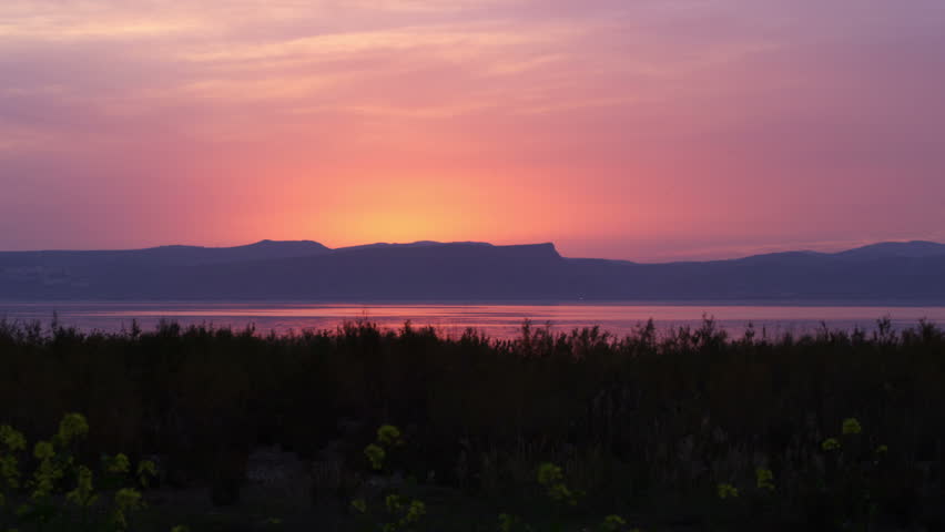 Beautiful yellow, pink and purple sunset over the Sea Of Galilee in Israel. 