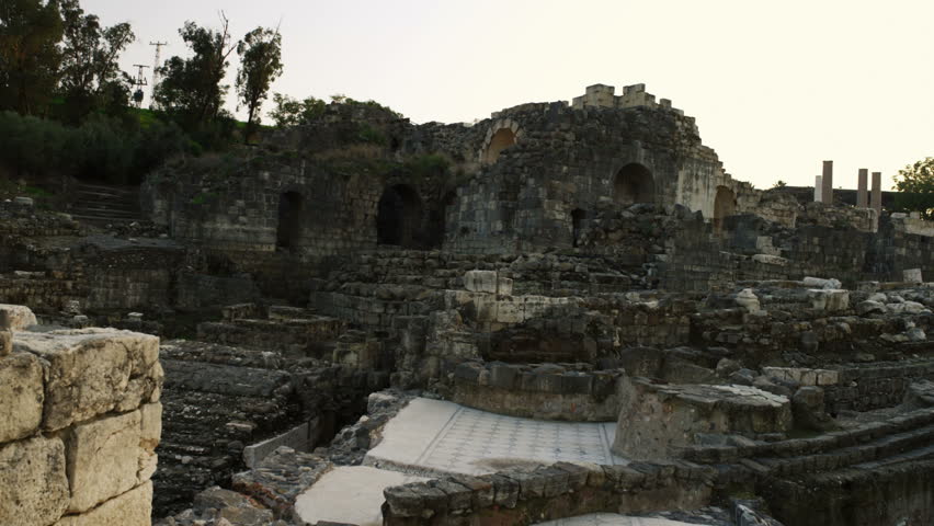 Dolly left to right of stone walls and structures, the ruins left from the Roman