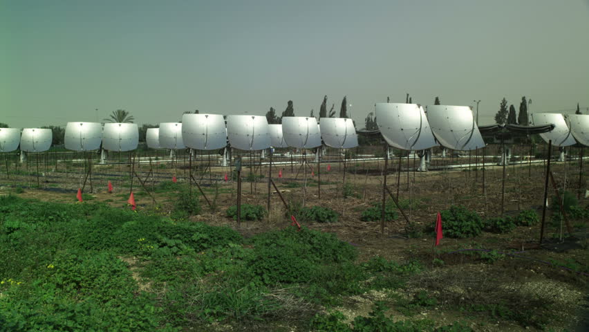 Wide, panning shot of the Zenith Solar panels at Kibbutz Yavne, Israel, with