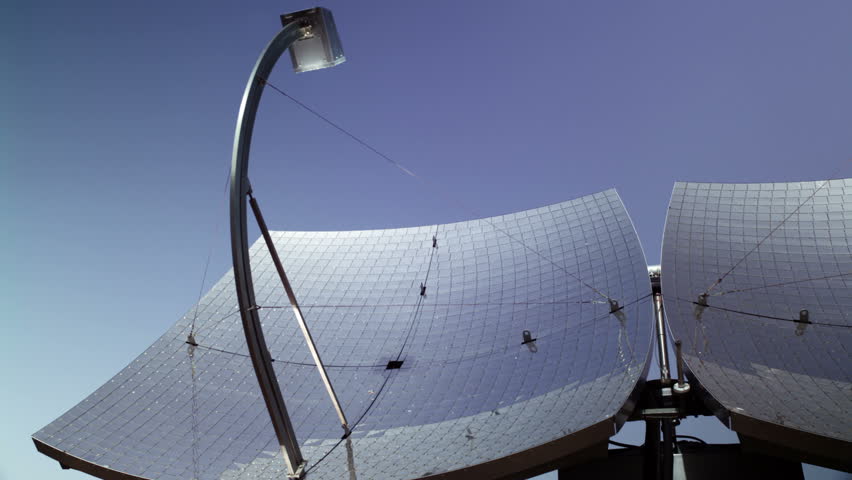 Tilt down from two solar panels to reveal a host of solar panels in the