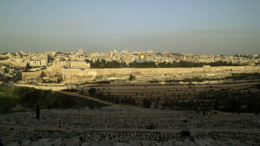 Wide shot of Old Jerusalem in Israel, just as the sun illuminates  the eastern
