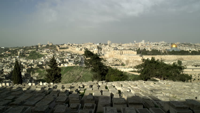 Wide pan of Old Jerusalem with the Mont of Olives cemetery 
