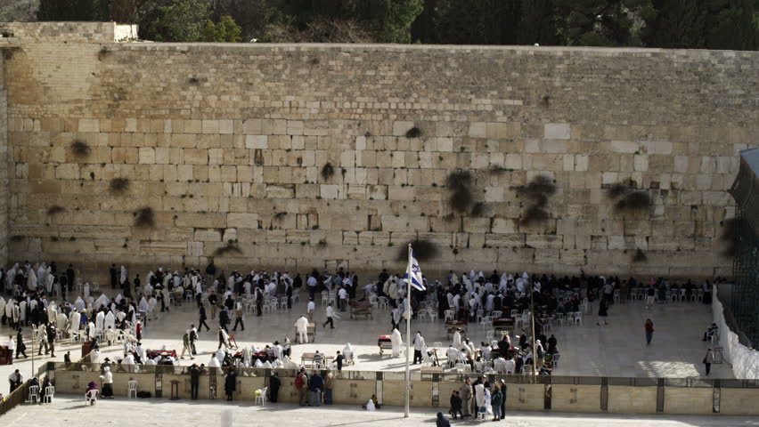 A downward view of the people below at the Western Wall (Wailing Wall) in the