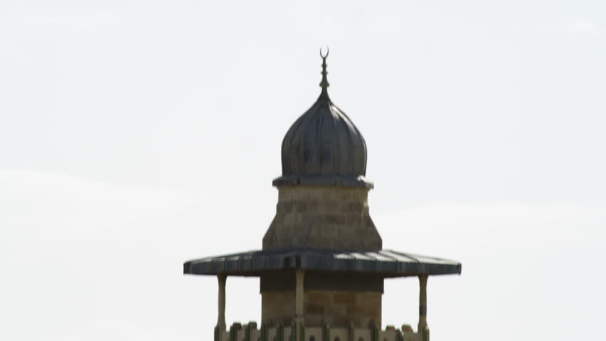 Tilt down a minaret in Jerusalem, Israel.  There is a second minaret in the