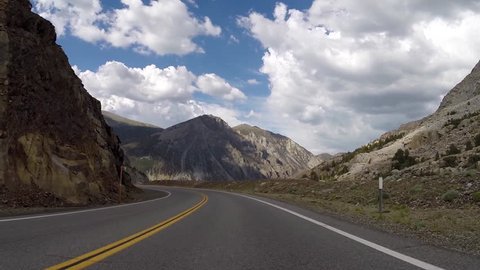 Yosemite National Park, California, USA - July 5, 2015:  Driving car mount time lapse on Tioga Pass Road in the Sierra Nevada Mountains.  