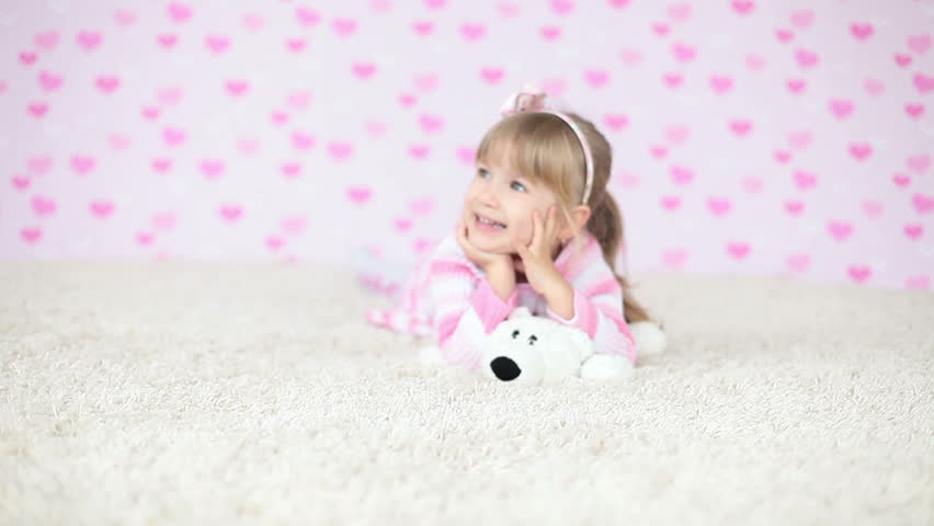  Smiling baby lying on the carpet 