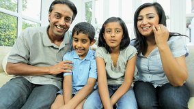Young Ethnic Family Using Online Video Chat