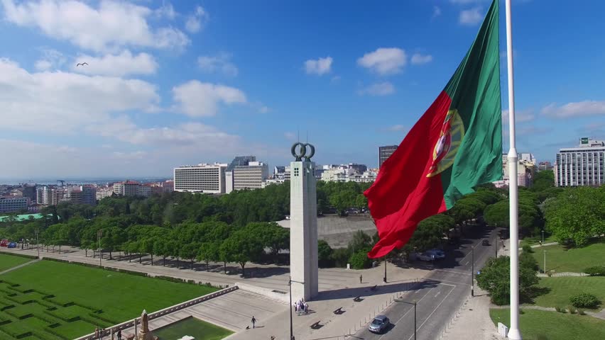 Portuguese Waving Flag in Eduardo VII Park in Lisbon, Portugal aerial view