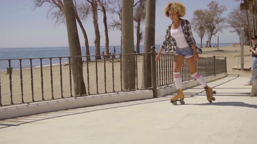 Woman Riding On Vintage Roller Skates.