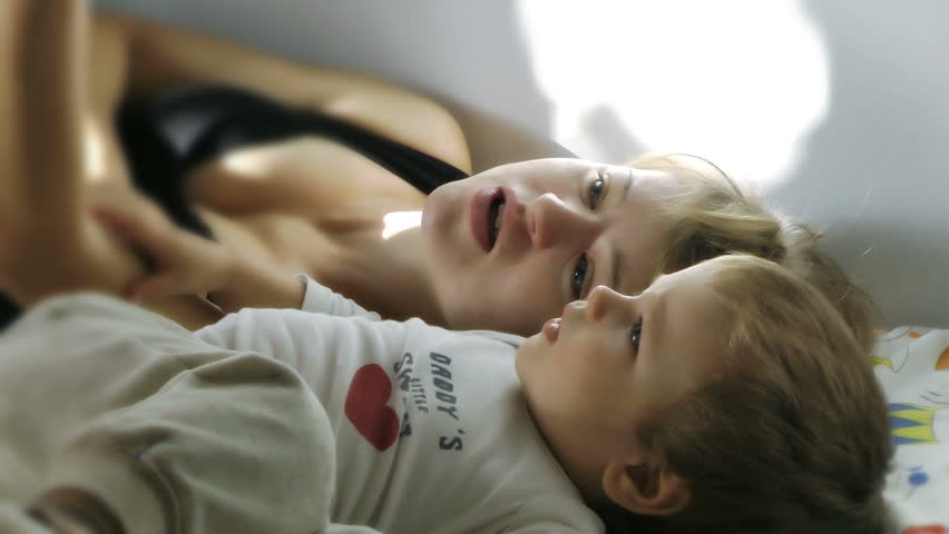 Mother and Baby Boy reading Bedtime Stories, Slow Motion