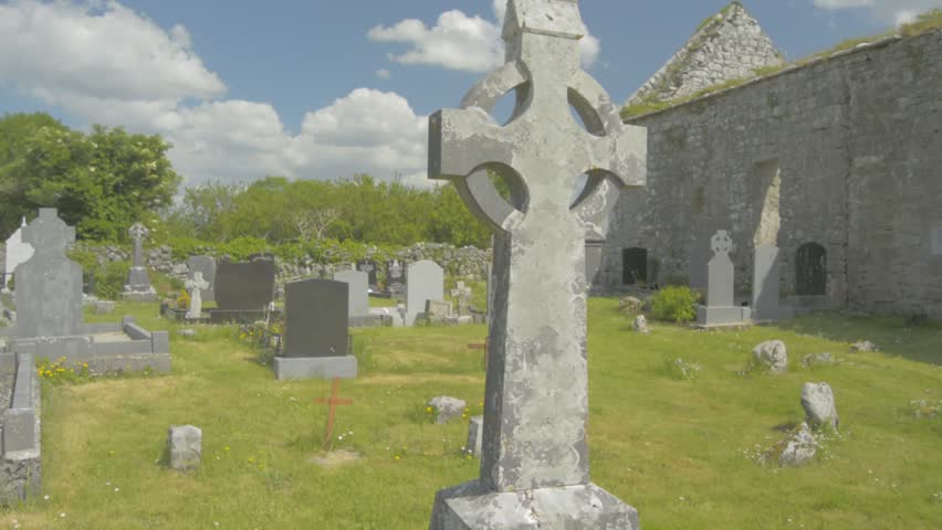 Celtic cross burial graveyard in County Clare, Ireland. Flat video profile.