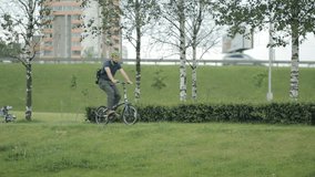 Man riding to the park with smartphone - Powered by Shutterstock - Get 15% off with code: PIKWIZARD15