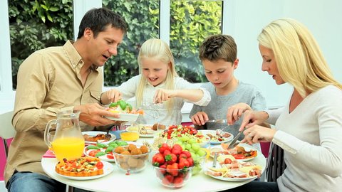 Young Caucasian Family Eating Healthy Lunch Stock Footage Video (100% ...