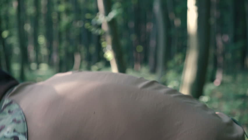 Close up of warrior wears body armor in the forest