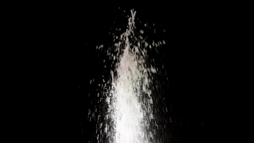 Fountain. water shoots up and drops on a black background Royalty-Free Stock Footage #17165974