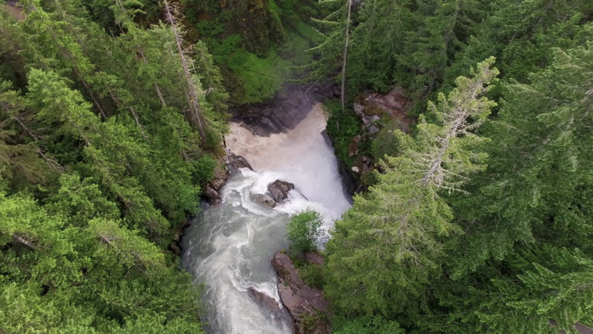 Aerial Fly Down Over River Forest Towards Nooksak Falls, Washington Waterfall