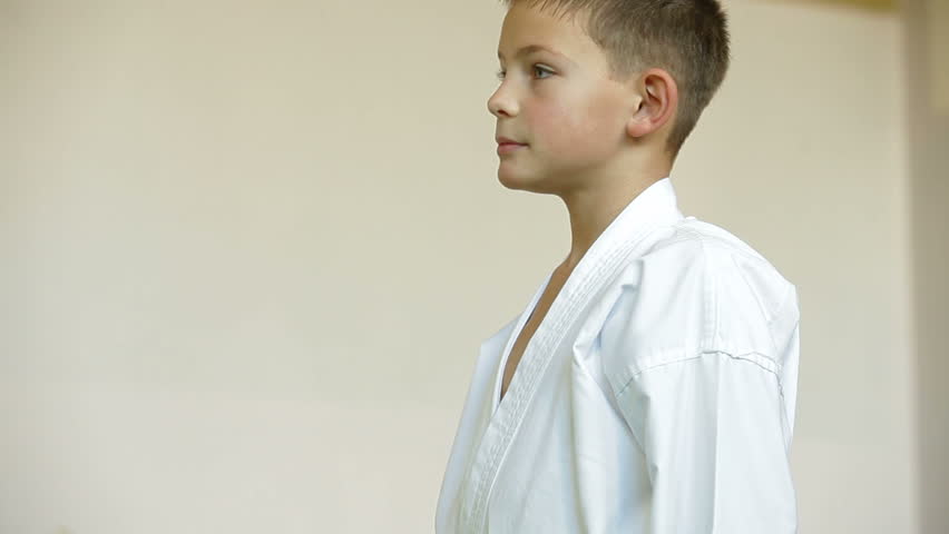 boy receive karate trophy and medal for the victory