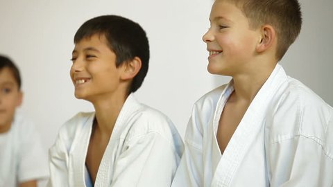 two children during training Karate in the gym