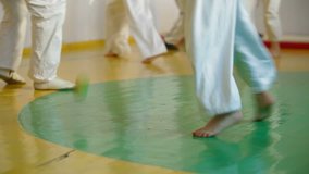 Children practice karate in gym