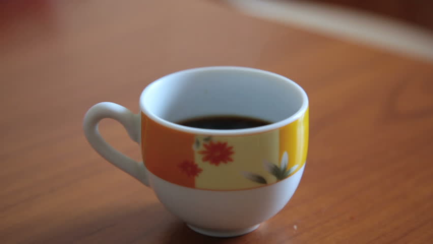 Smoke is Coming out of a Cup of Coffe