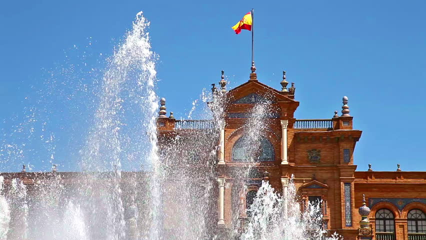close up of the fountain at Plaza de Espana square in Seville city with main building and spanish flag, Andalusia, Spain