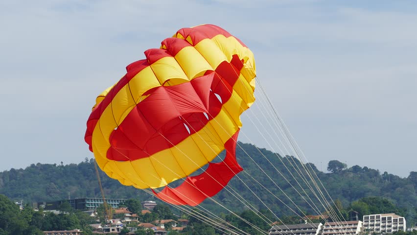 A parachute being towed at sea. 