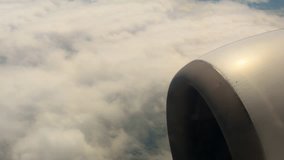 view of a jet air plane engine above clouds, travelling by air (Full high definition video) Full HD, UHD, 4k
