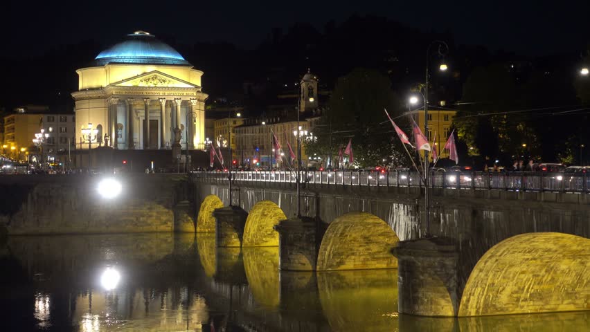 establishing shot of turin city at night vittorio emanuele bridge and gran madre di dio church