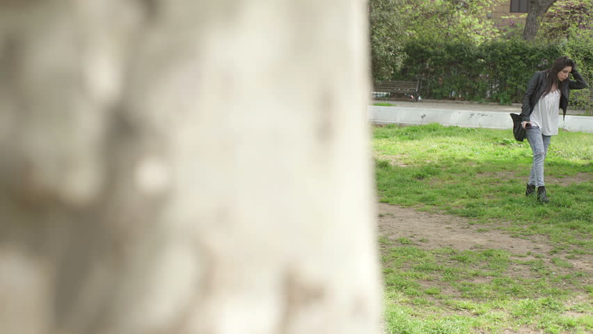 hide view of young woman vomiting in a park